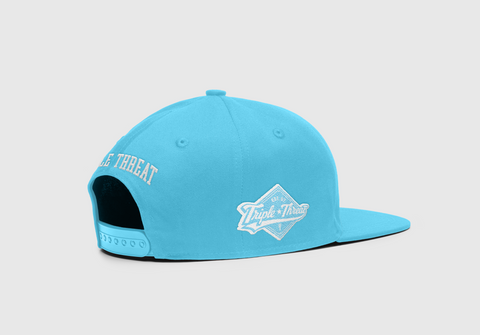 side back view of Triple Threat blue snapback with "Triple Threat" embroidered at the back and the diamond logo on side 