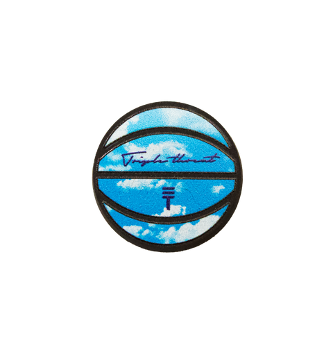 Triple Threat Croc charm of a basketball with black tread with 'Triple Threat' in script with the Triple Threat logo and blue sky with clouds design 