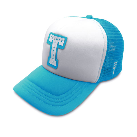 Triple Threat Block Trucker Hat in blue with a breathable mesh back, adjustable snapback closure, structured front panels, and high-quality embroidered logo.