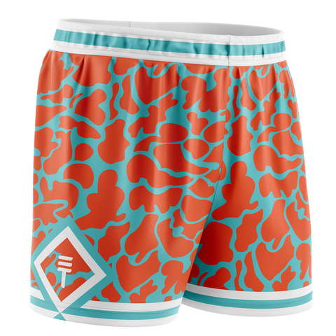 camo basketball shorts in orange and teal, with white trim around waist and leg holes featuring a diamond design with a Triple Threat logo inside 