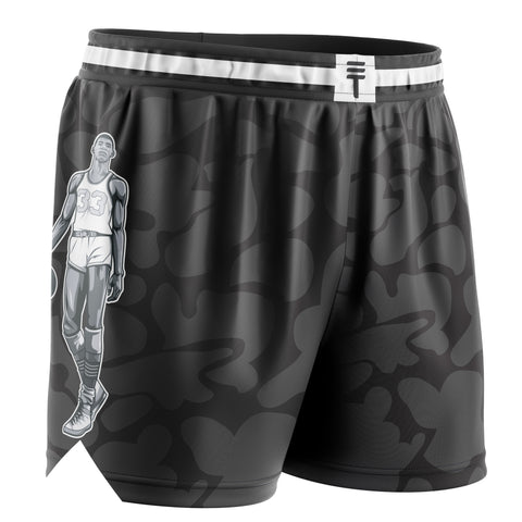 black camo basketball shorts with Kareem Abdul-Jabbar in basketball clothing as cartoon on side, a Triple Threat logo on the middle front of the waistband in black