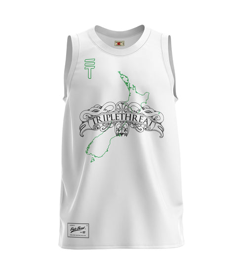 White basketball singlet with green New Zealand map and ornate "Triple Threat" logo in black, featuring the Triple Threat logo, displayed on a plain background