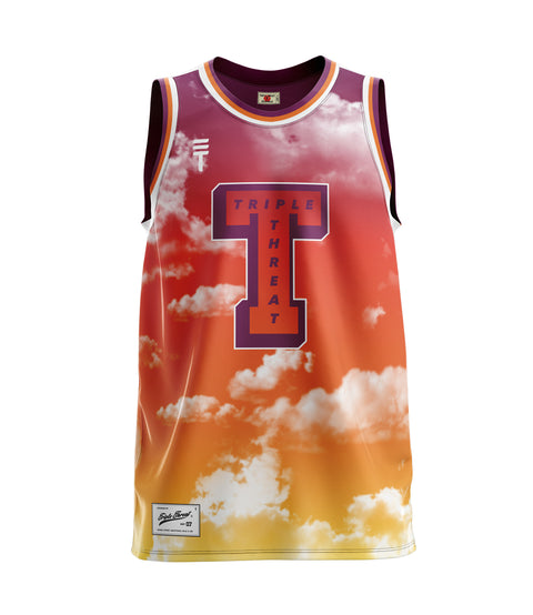 Red and yellow basketball singlet with Triple Threat logo and large T shape with "Triple Threat" text inside, featuring a sunset sky design with clouds