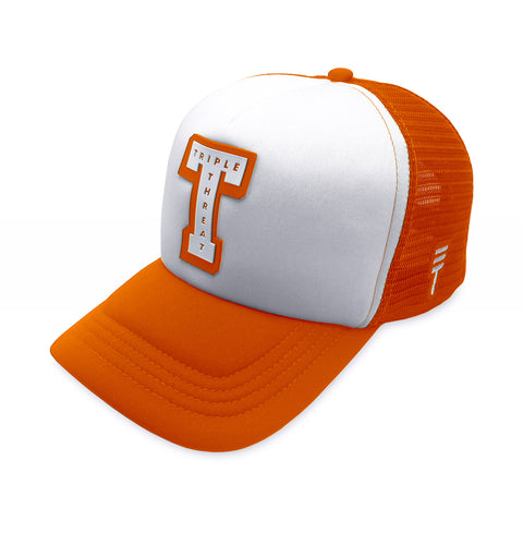 Triple Threat Block Trucker Hat in orange with a breathable mesh back, adjustable snapback closure, structured front panels, and high-quality embroidered logo